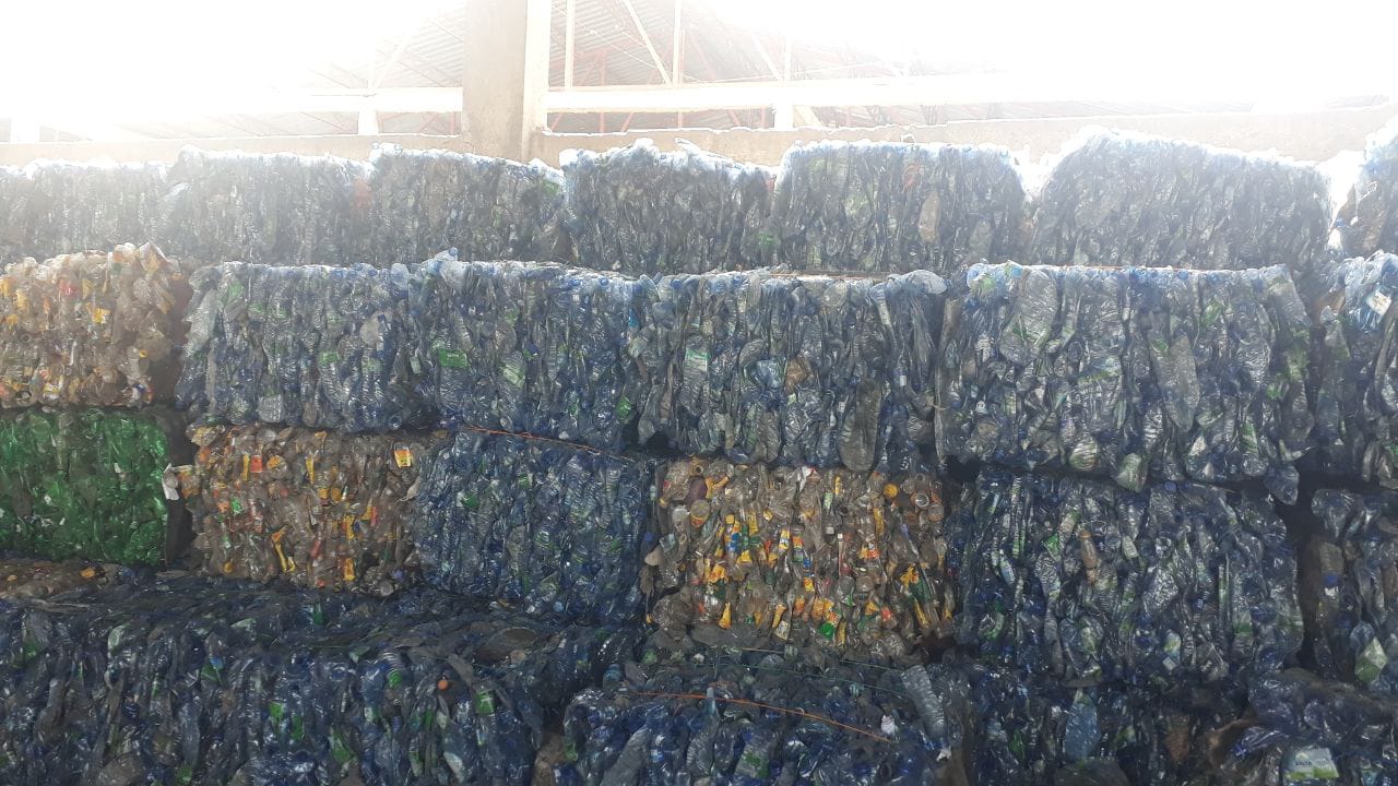 Baled plastic bottles at recycling facility